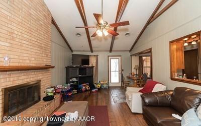 5211 South Milam Street Amarillo, TX 79110 - Photo 6 of 31 a living room with furniture and a fireplace