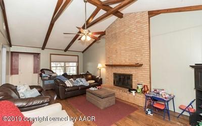 5211 South Milam Street Amarillo, TX 79110 - Photo 7 of 31 a living room with furniture and a fireplace