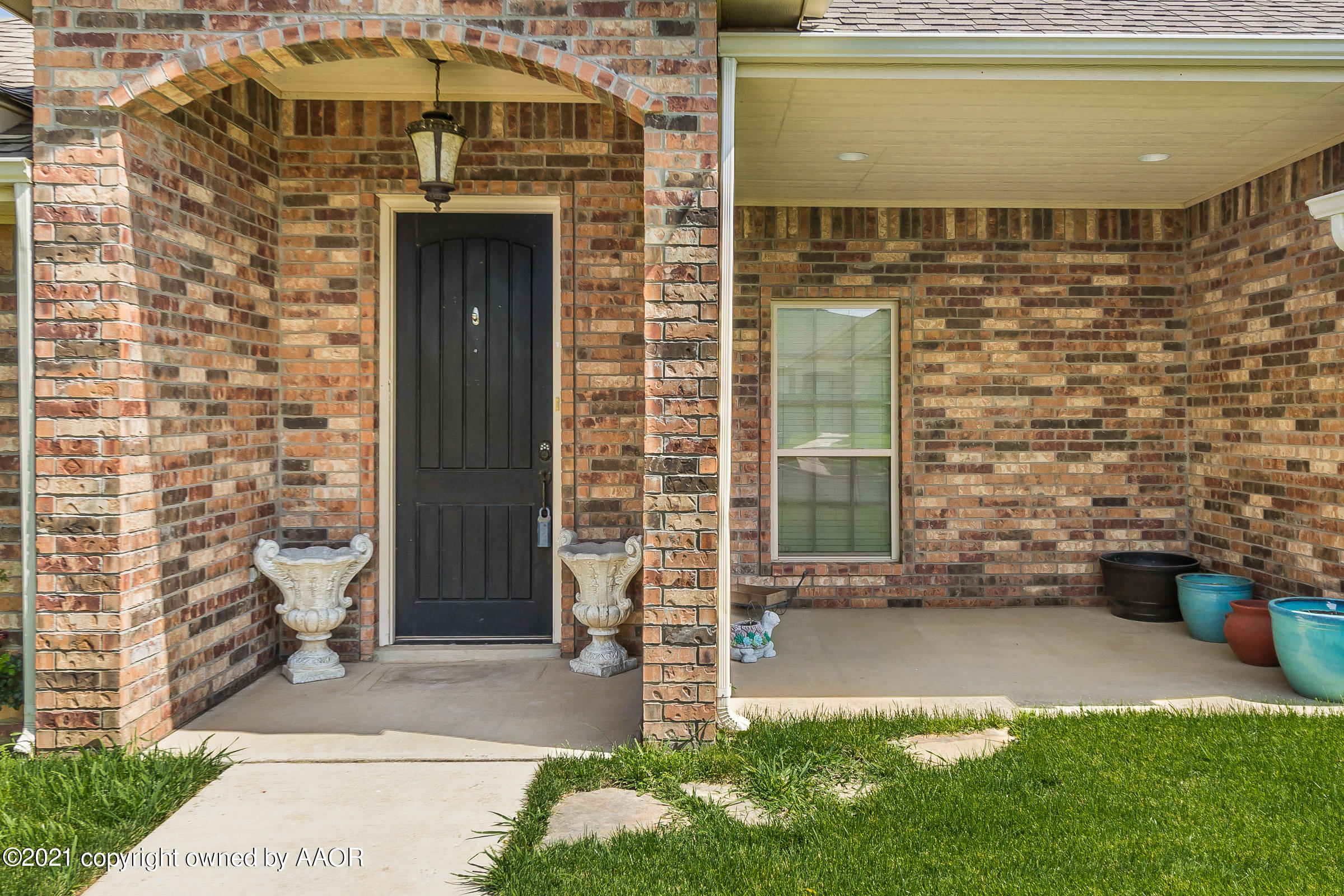 3908 Arden Road Amarillo, TX 79118 - Photo 2 of 25 a front view of a house with a yard