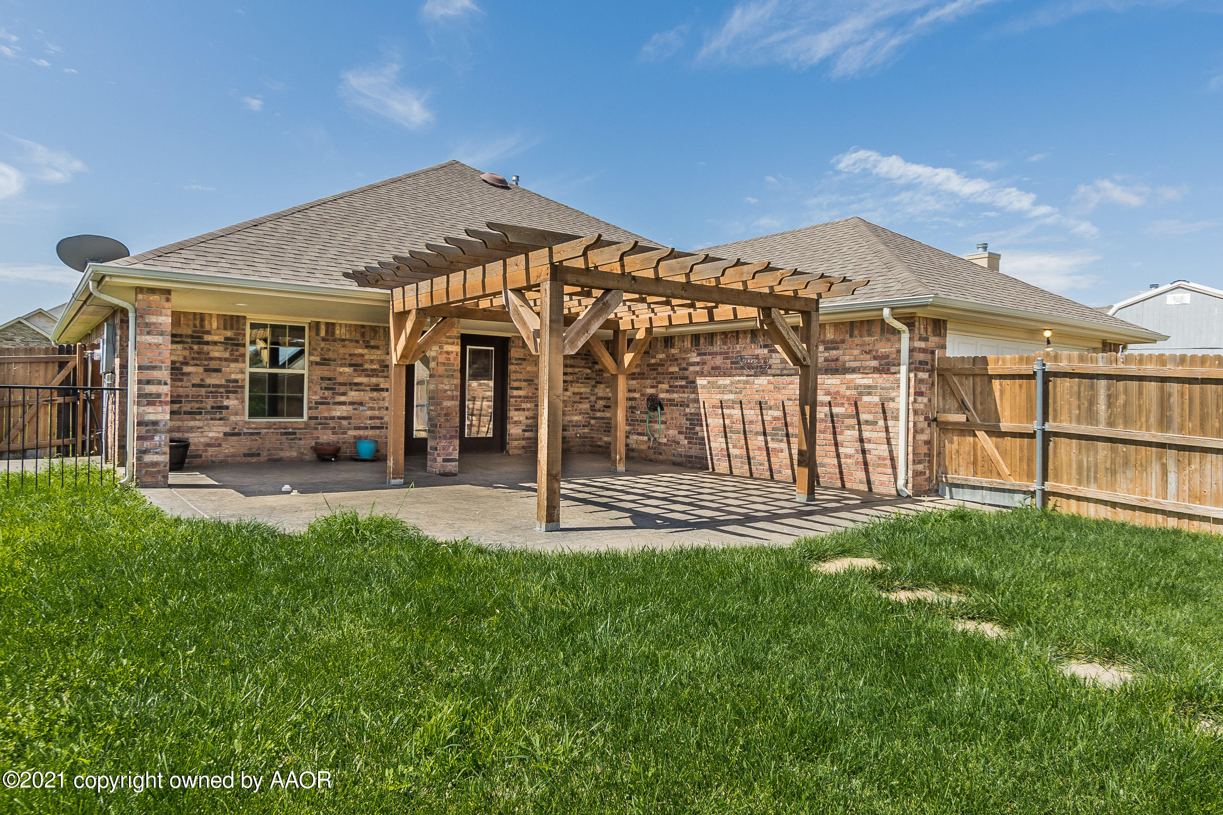 3908 Arden Road Amarillo, TX 79118 - Photo 20 of 25 a view of a house with a yard and sitting area