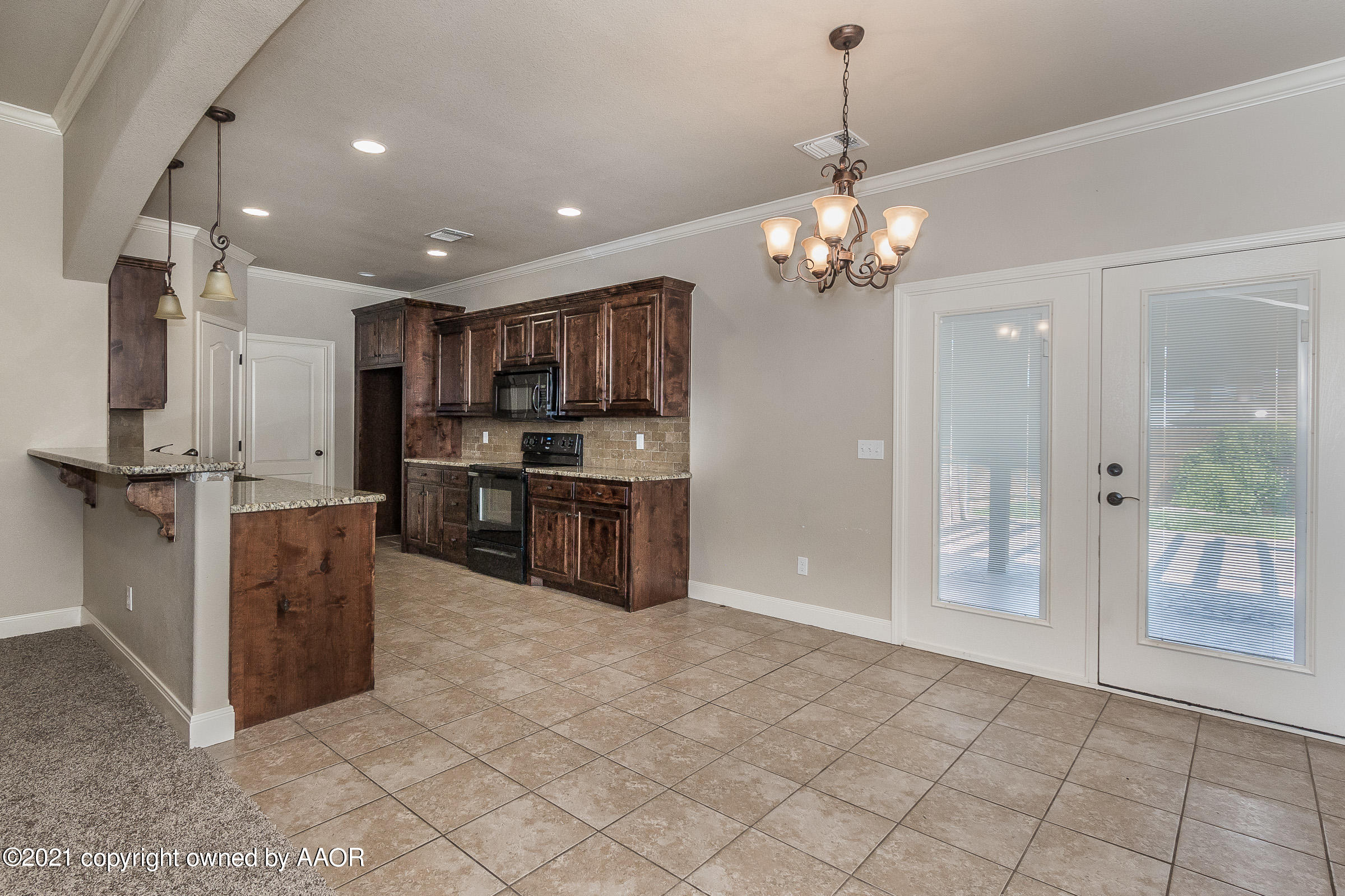 3908 Arden Road Amarillo, TX 79118 - Photo 6 of 25 a kitchen with stainless steel appliances granite countertop a refrigerator and a sink