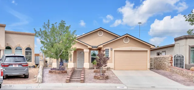 a view of a car park in front of house