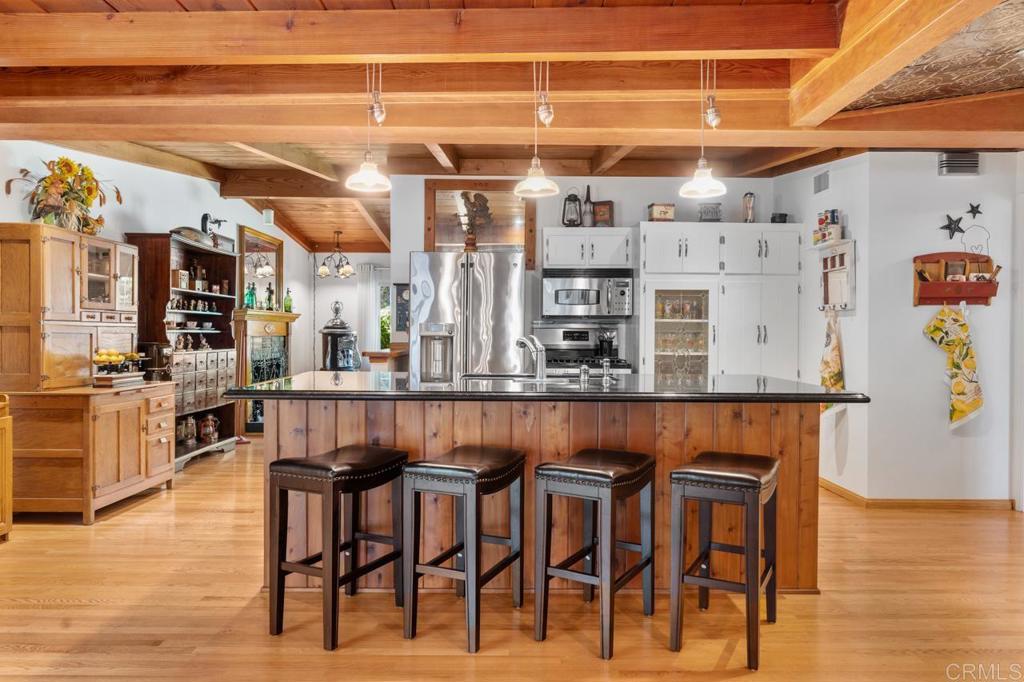 220 Hoover Street Oceanside, CA 92054 - Photo 18 of 70 a dining table with chairs and wooden floor