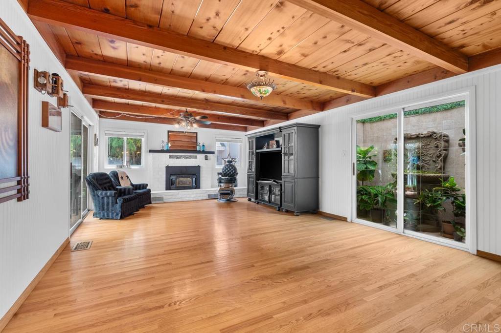 220 Hoover Street Oceanside, CA 92054 - Photo 19 of 70 a view of an empty room with furniture fireplace and windows