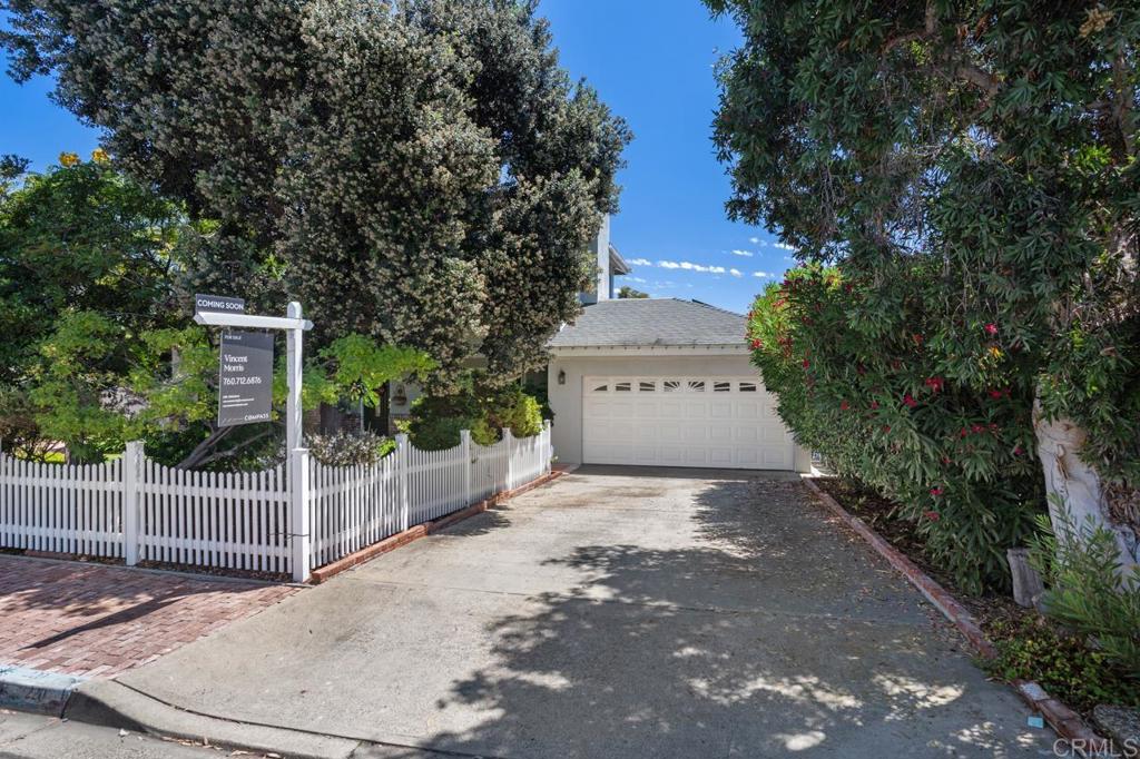 220 Hoover Street Oceanside, CA 92054 - Photo 2 of 70 a view of a house with a small yard and a large tree