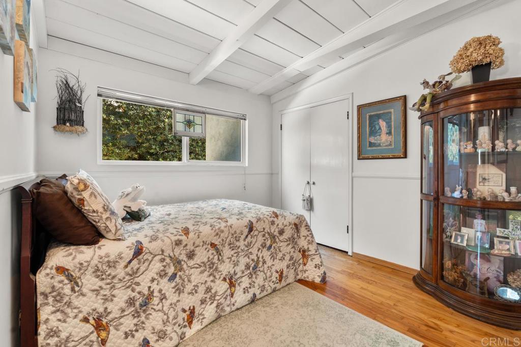 220 Hoover Street Oceanside, CA 92054 - Photo 21 of 70 a bedroom with a bed and a window