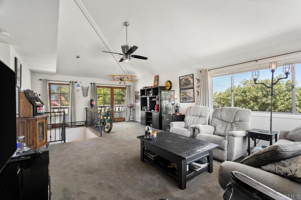 220 Hoover Street Oceanside, CA 92054 - Photo 28 of 70 a living room with furniture and a flat screen tv