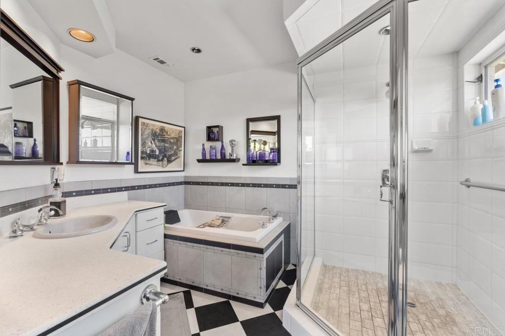 220 Hoover Street Oceanside, CA 92054 - Photo 36 of 70 a bathroom with a sink mirror and a shower
