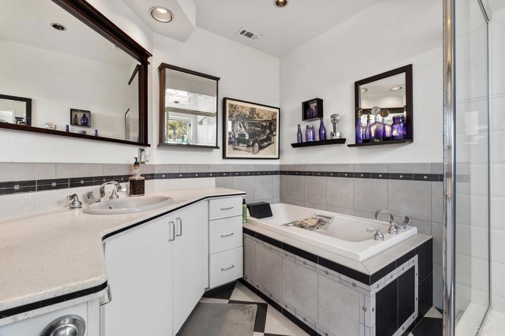 220 Hoover Street Oceanside, CA 92054 - Photo 37 of 70 a bathroom with a sink and a mirror
