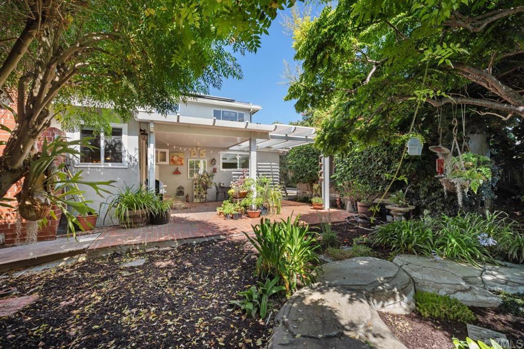 220 Hoover Street Oceanside, CA 92054 - Photo 44 of 70 a view of a house with backyard sitting area and garden