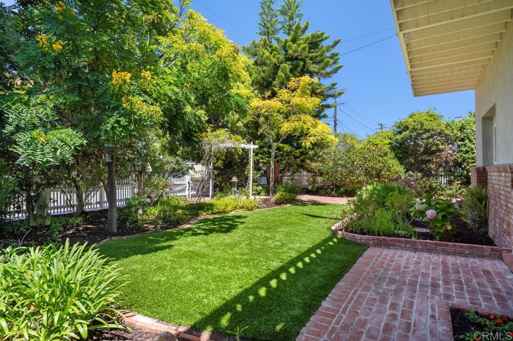 220 Hoover Street Oceanside, CA 92054 - Photo 7 of 70 a view of a yard with plants and large trees