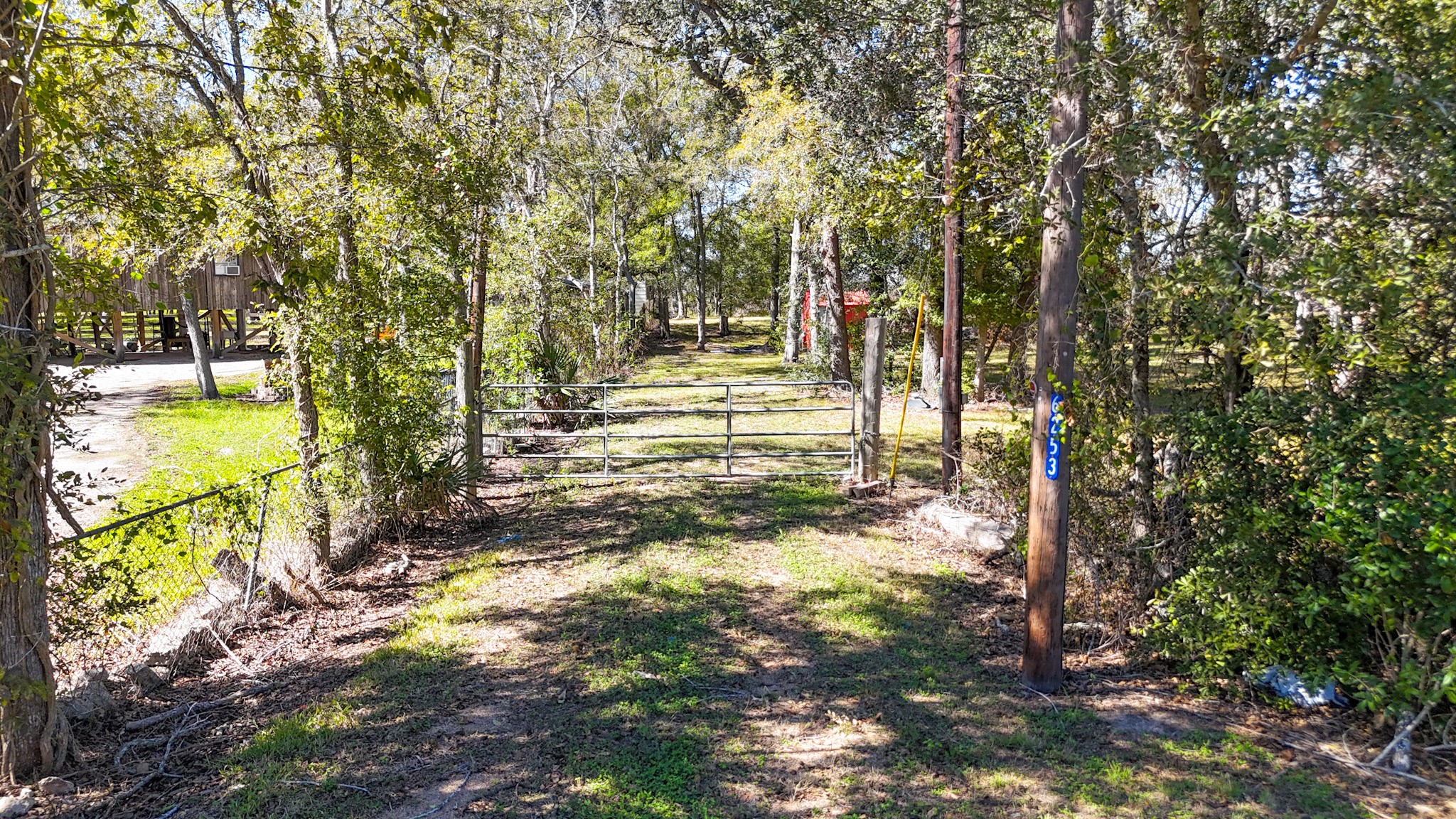6253 North FM 441 Road El Campo, TX 77437 - Photo 2 of 7 a view of a yard with trees