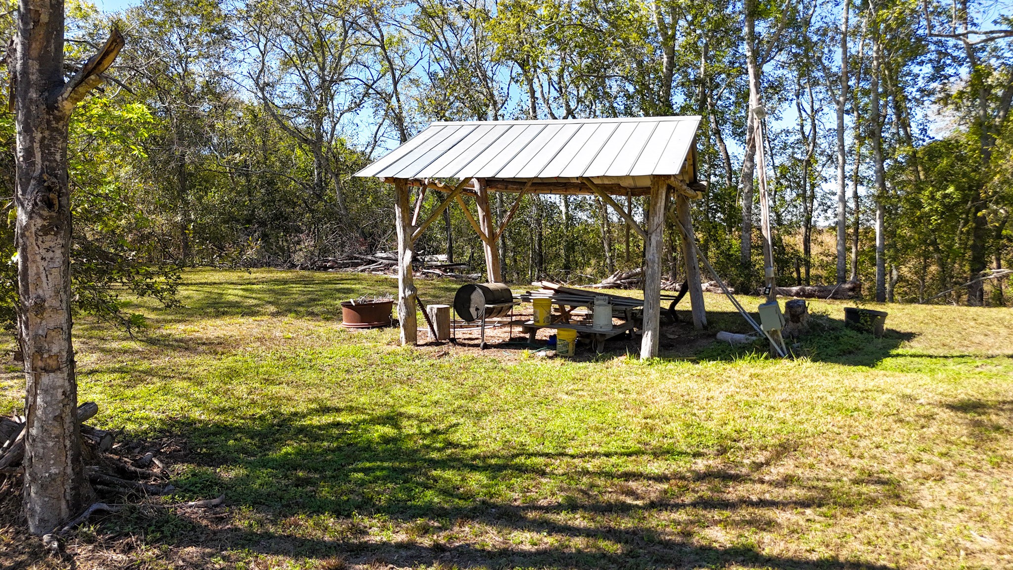 6253 North FM 441 Road El Campo, TX 77437 - Photo 6 of 7 a view of swimming pool with lawn chairs under an umbrella