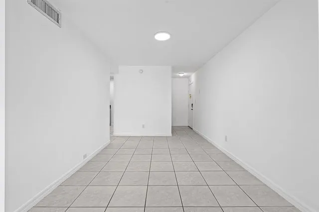 an empty room with white walls