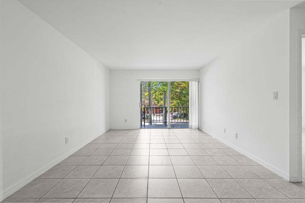 9225 Southwest 87th Avenue, Unit A7 Miami, FL 33176 - Photo 15 of 35 an empty room with windows