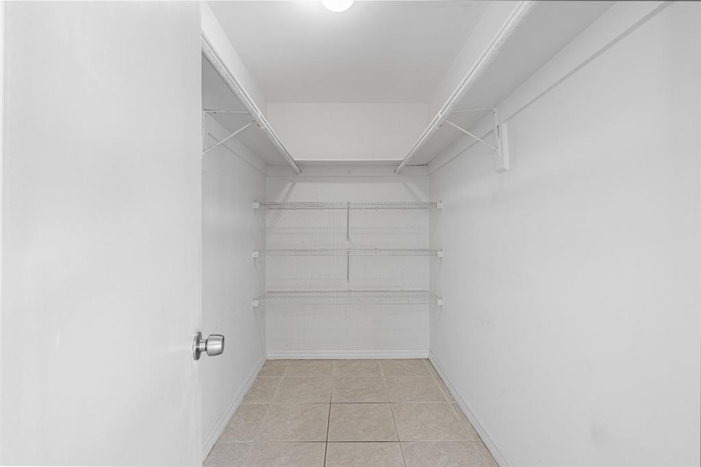 9225 Southwest 87th Avenue, Unit A7 Miami, FL 33176 - Photo 25 of 35 a view of an empty walk in closet