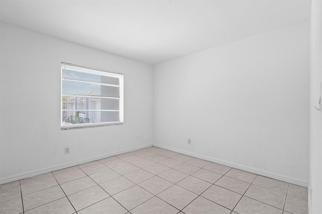 9225 Southwest 87th Avenue, Unit A7 Miami, FL 33176 - Photo 26 of 35 an empty room with windows