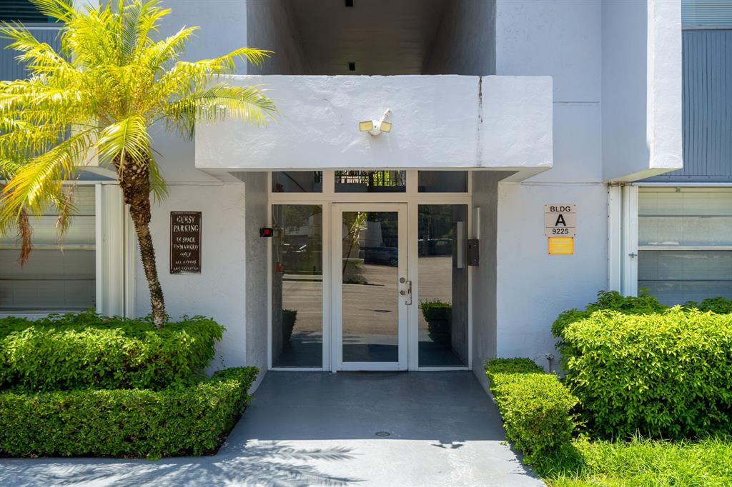 9225 Southwest 87th Avenue, Unit A7 Miami, FL 33176 - Photo 3 of 35 a front view of a house with basket ball court