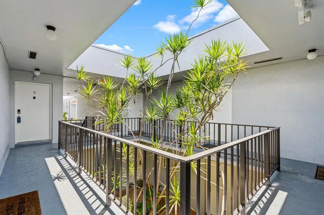 a view of balcony with wooden floor