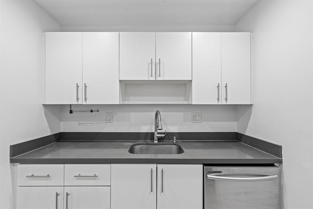 9225 Southwest 87th Avenue, Unit A7 Miami, FL 33176 - Photo 6 of 35 a kitchen with a sink cabinets and appliances