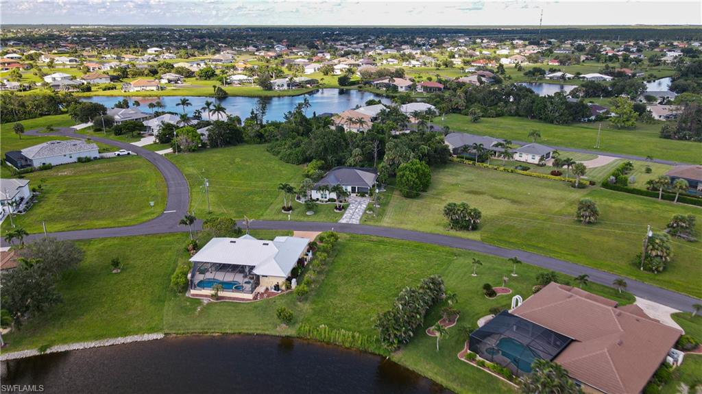 24083 Cedar Rapids Road Punta Gorda, FL 33955 - Photo 7 of 11 an aerial view of lake residential houses with outdoor space and swimming pool