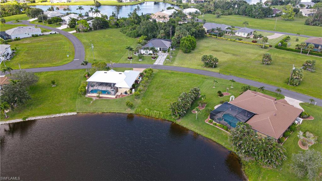24083 Cedar Rapids Road Punta Gorda, FL 33955 - Photo 8 of 11 an aerial view of a house with a garden and lake view