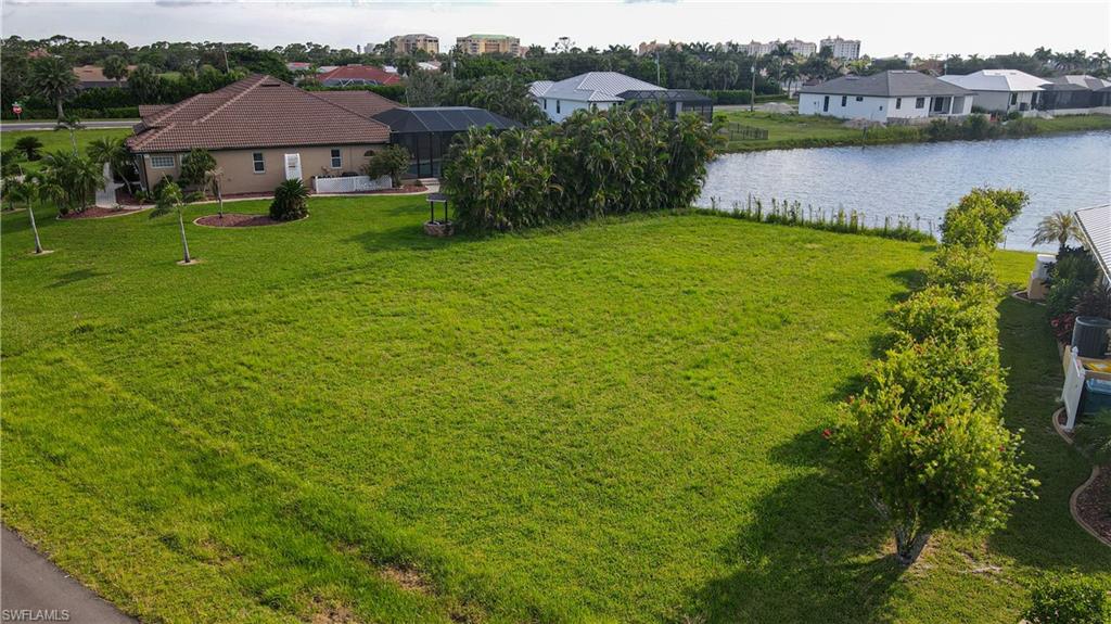 24083 Cedar Rapids Road Punta Gorda, FL 33955 - Photo 10 of 11 a view of a house with a yard and a table