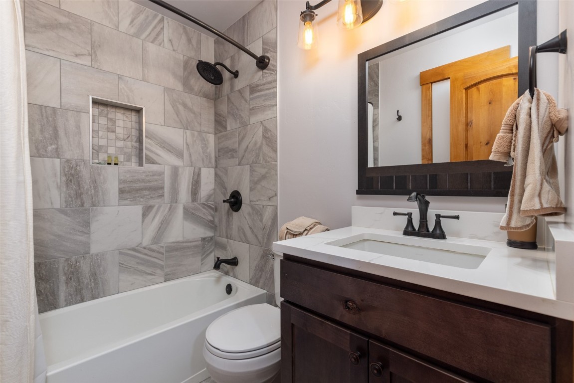 500 Bills Ranch Road, Unit 251 Frisco, CO 80443 - Photo 15 of 33 a bathroom with a granite countertop sink toilet and shower