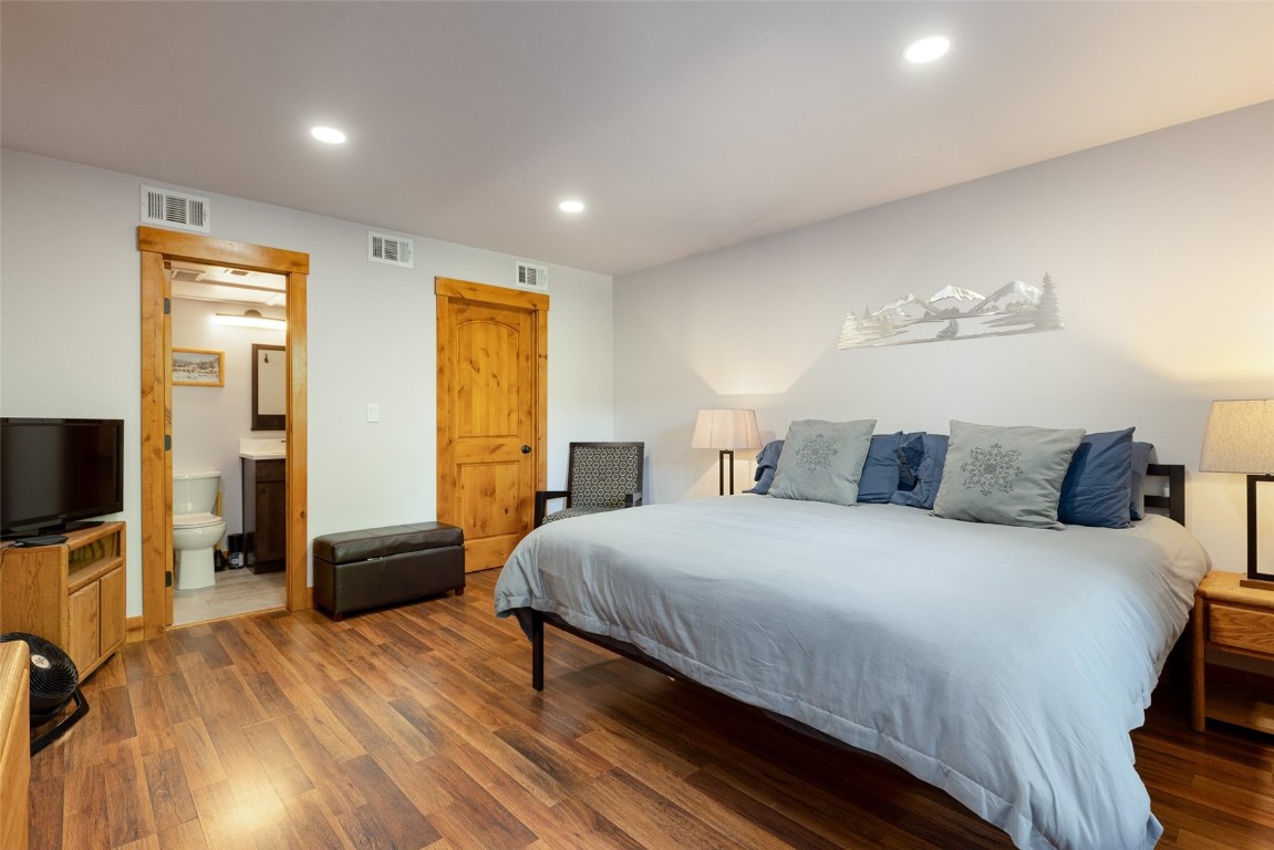 500 Bills Ranch Road, Unit 251 Frisco, CO 80443 - Photo 6 of 33 a bedroom with a bed and wooden floor