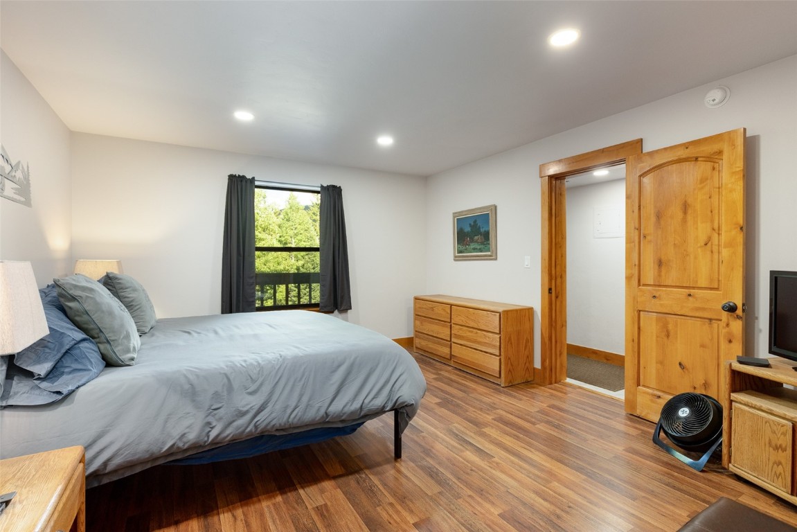 500 Bills Ranch Road, Unit 251 Frisco, CO 80443 - Photo 7 of 33 a bedroom with a bed and wooden floor
