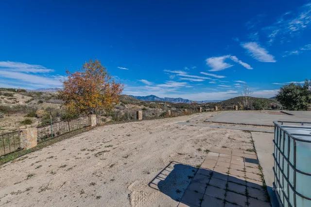 a view of a yard with an ocean
