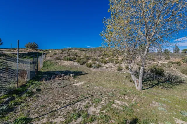 a view of a yard with an outdoor space