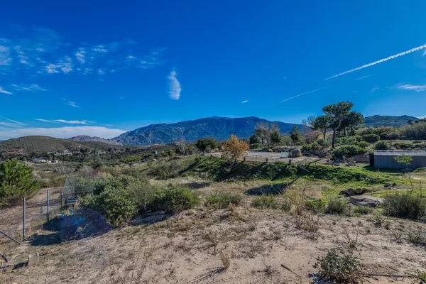 a view of a street with a yard