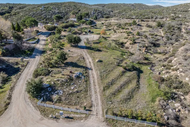 view of a house with a yard and sitting area
