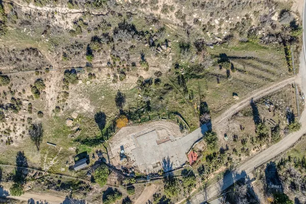 an aerial view of mountain with an ocean