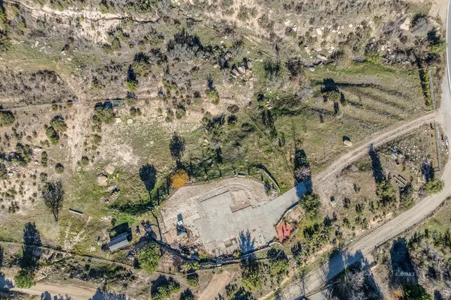 an aerial view of mountain with an ocean