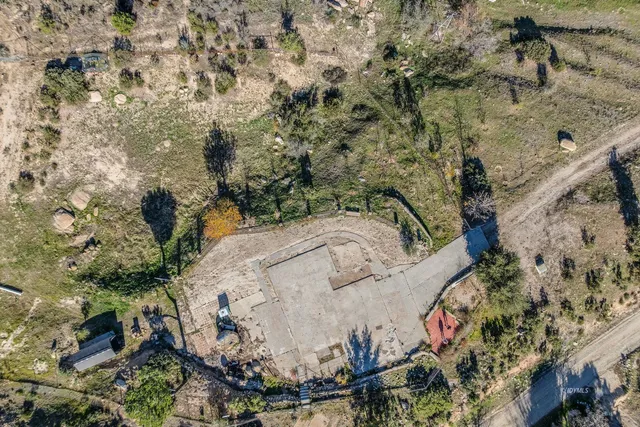 a view of a large mountain with mountains in the background