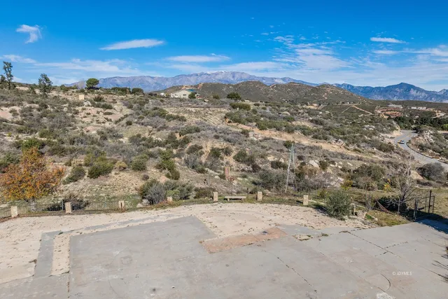 a view of a mountain with a lake view