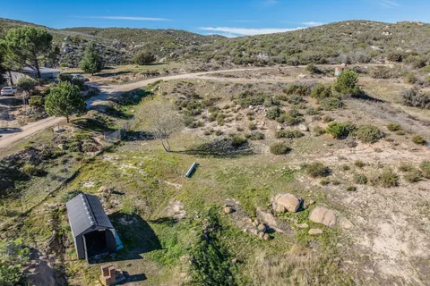 an aerial view of residential house and green space