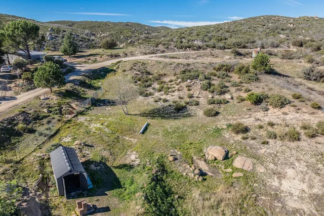 an aerial view of residential house and green space