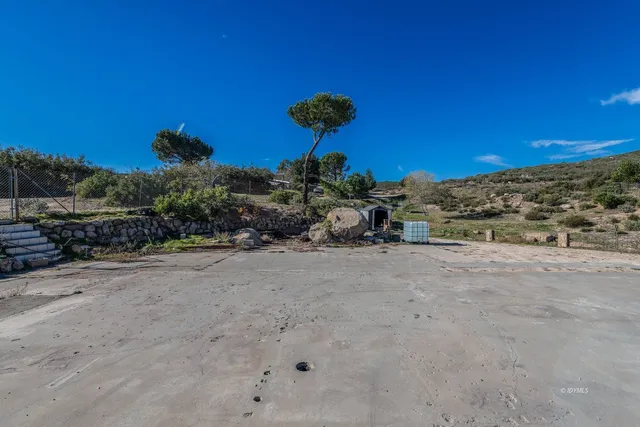 a view of a street with a building in the background