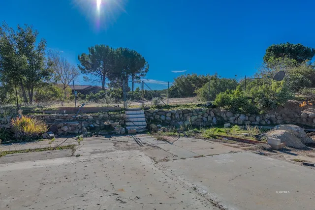 a view of a road with a yard