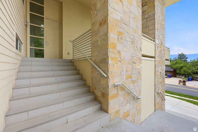 1389 Millbrook Way Bountiful, UT 84010 - Photo 11 of 74 Stone veneer exterior with light siding features a grand entryway