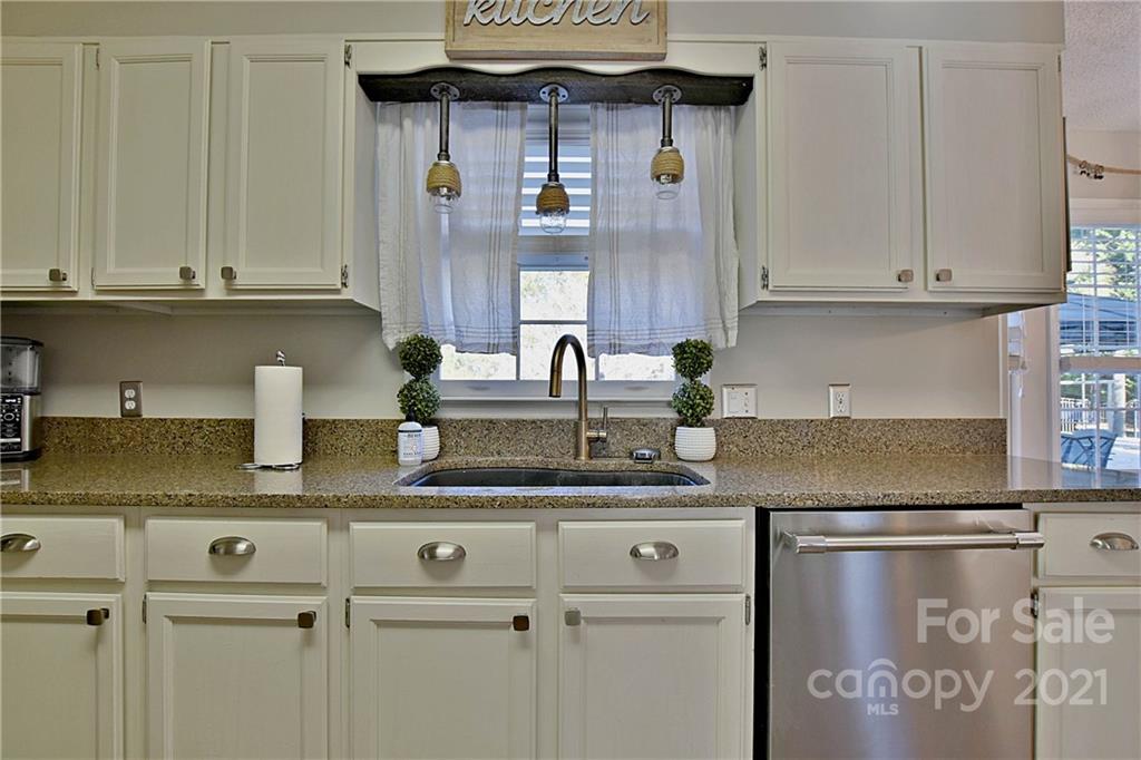 2984 Timber Ridge Lane Rock Hill, SC 29732 - Photo 13 of 32 a kitchen with stainless steel appliances granite countertop a sink and cabinets