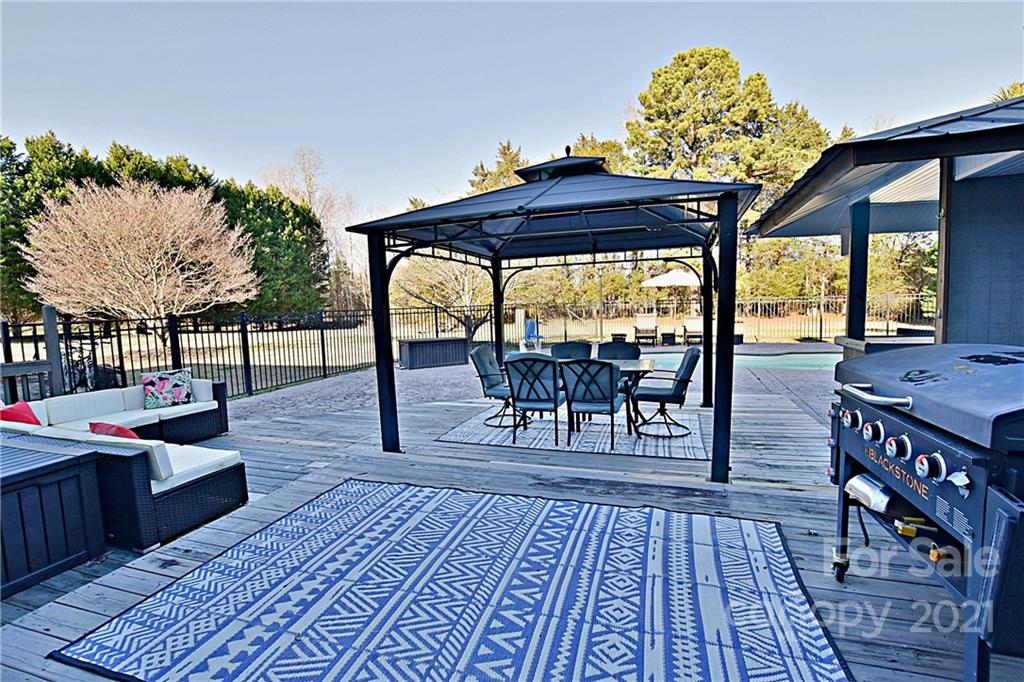 2984 Timber Ridge Lane Rock Hill, SC 29732 - Photo 27 of 32 a view of a dinning table and chairs in the patio