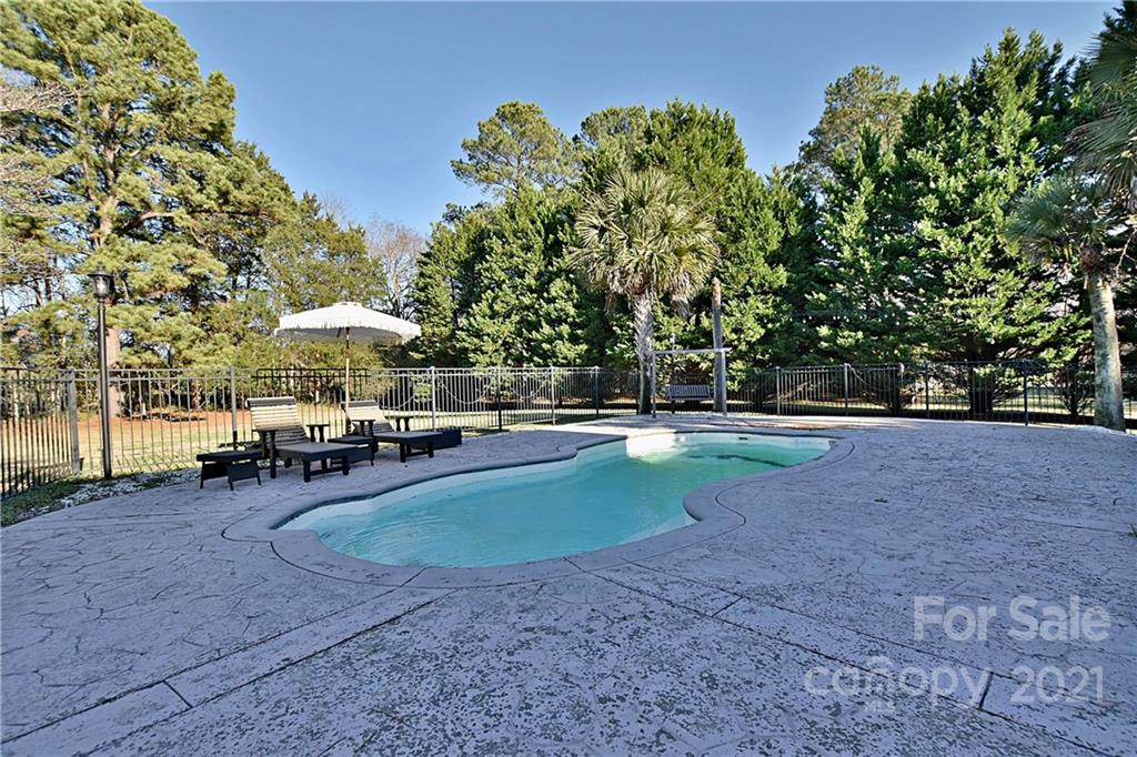 2984 Timber Ridge Lane Rock Hill, SC 29732 - Photo 29 of 32 a view of a swimming pool with a patio and a yard