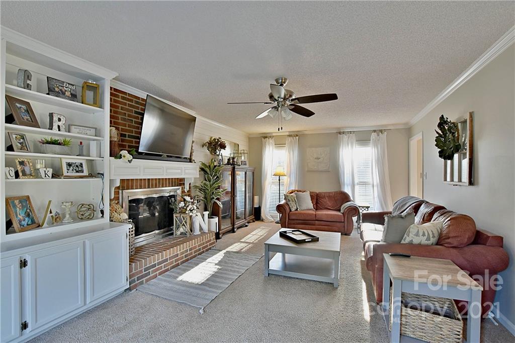 2984 Timber Ridge Lane Rock Hill, SC 29732 - Photo 5 of 32 a living room with furniture fireplace and flat screen tv