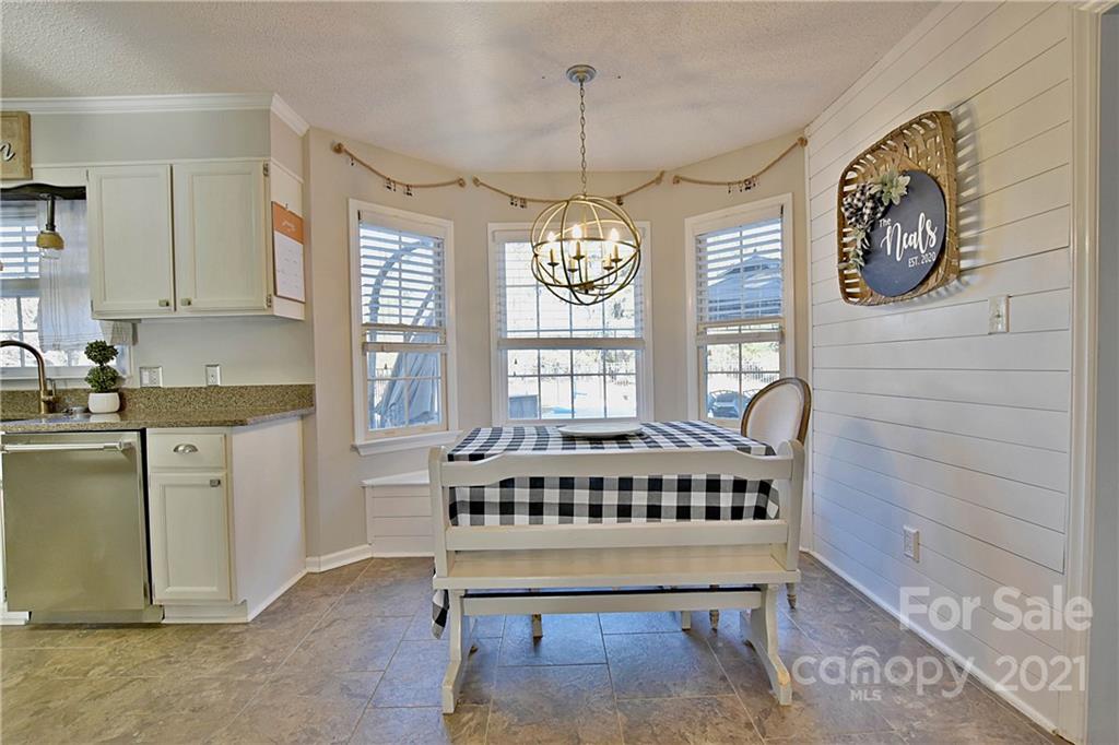 2984 Timber Ridge Lane Rock Hill, SC 29732 - Photo 9 of 32 a spacious bedroom with a bed a dresser and windows