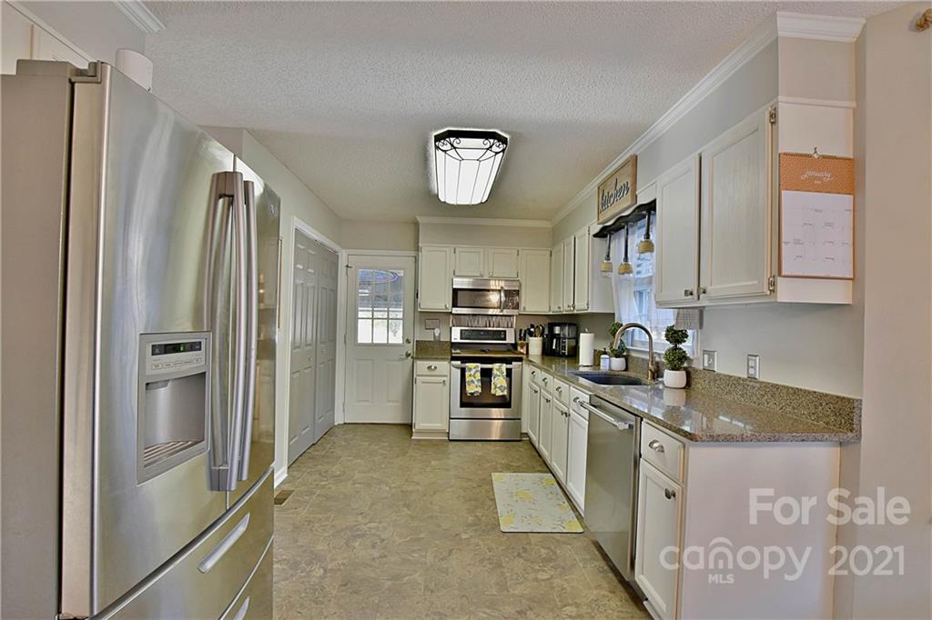 2984 Timber Ridge Lane Rock Hill, SC 29732 - Photo 10 of 32 a kitchen with stainless steel appliances granite countertop a refrigerator a stove and a sink