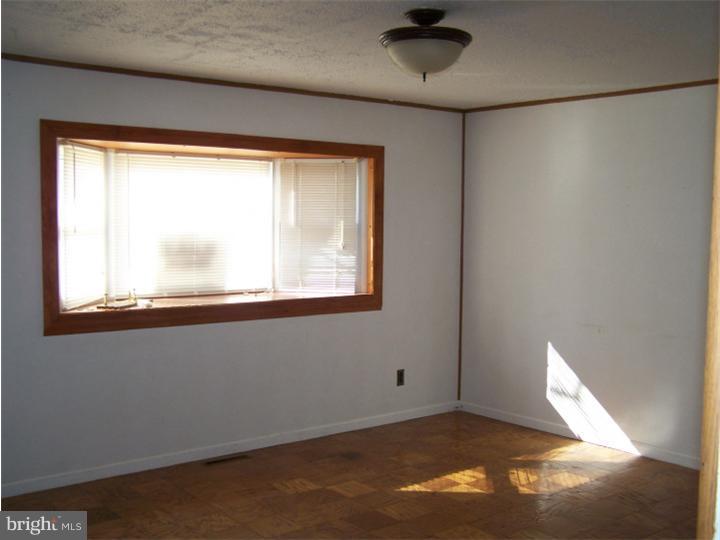 101 Nathaniel Road Newark, DE 19713 - Photo 5 of 13 a view of an empty room with a window